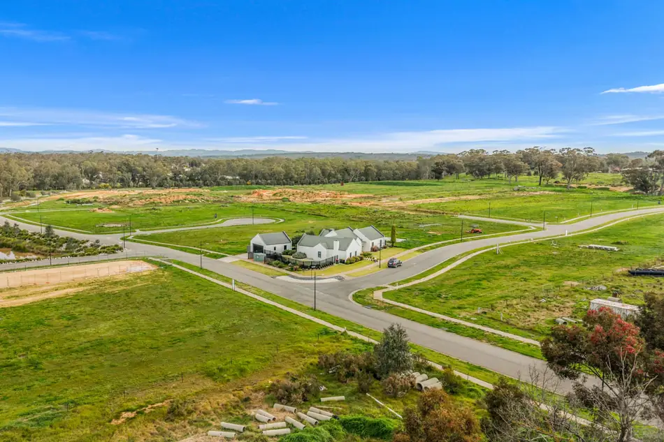 Aerial view across the completed streets of Sommerfields Estate with a new home on the corner
