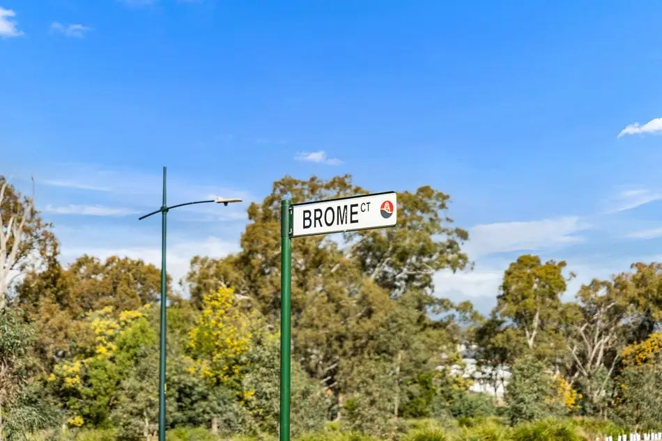 Brome Court street sign at Sommerfields Estate framed by native trees