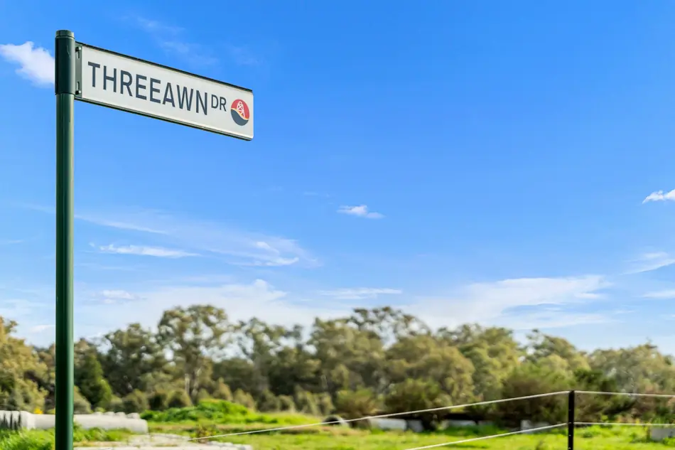 Threeawn Drive street sign at Sommerfields Estate against a blue sky