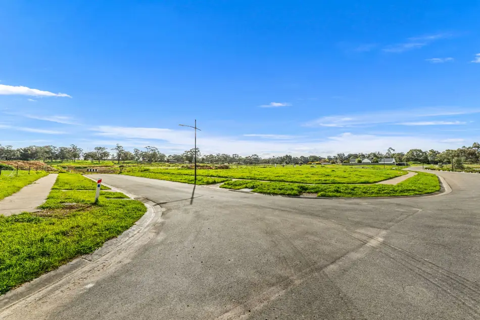 Wide open allotments and new roads at Sommerfields Estate under a clear sky